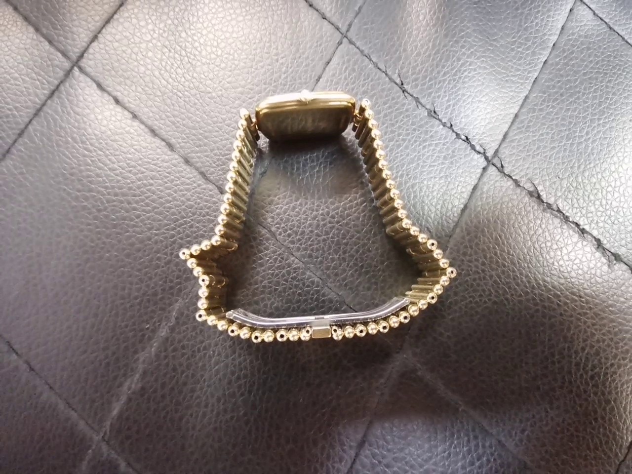 Raymond Weil Geneve Damenuhr Goldfarben, Elegante Quarzuhr mit rechteckigem Gehäuse, weißem Zifferblatt, römischen Ziffern und Gliederarmband. | Zustand: Gut – Bild 2