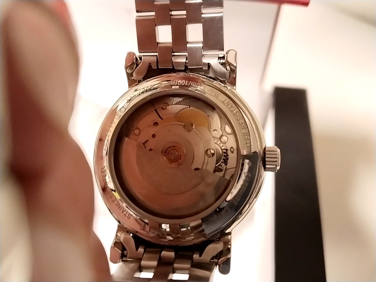 Tissot Le Locle Automatik Edelstahl, Herrenuhr mit weißem Zifferblatt, Datumsanzeige, Edelstahlarmband und Sichtboden. OVP | Zustand: Sehr Gut – Bild 3