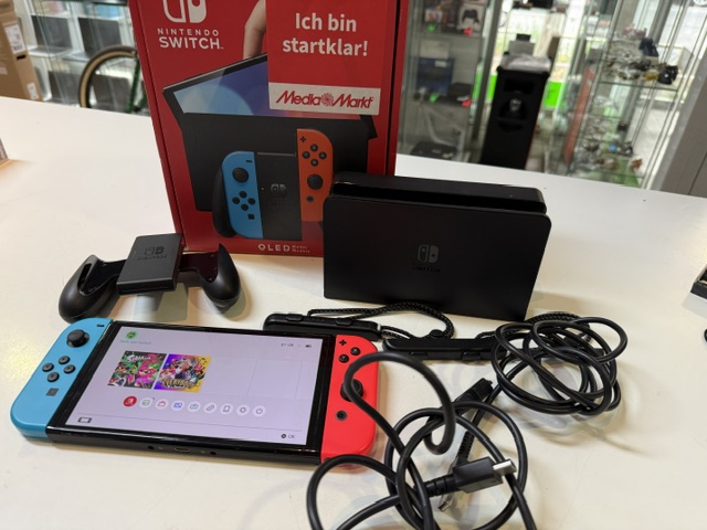 Nintendo Switch OLED Neon-Rot/Neon-Blau, Inkl. Spiel Splatoon 2, Originalverpackung, Dockingstation, Netzteil und HDMI-Kabel. | Zustand: Sehr Gut | Farbe: schwarz – Bild 2