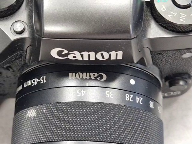 Canon EOS M5 2016 Schwarz, Spiegellose Systemkamera, 24,2 Megapixel, APS-C Sensor, abgenutzter Gummigriff, stark verschmutzt, Zubehör: Trageriemen, 2x Akkus, Ladestation | Zustand: In Ordnung – Bild 5